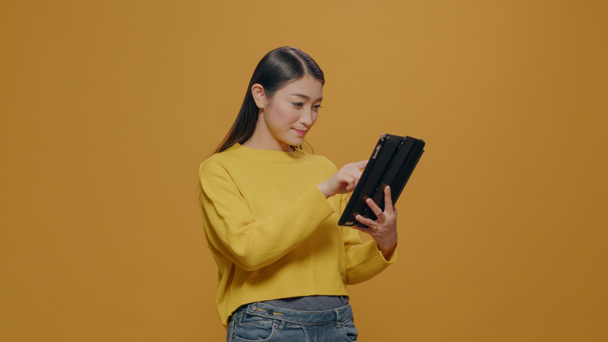 Casual person using digital tablet with touch screen
